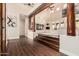 Bright living room showcasing hardwood floors, timber beam, fireplace, and soaring ceilings at 4822 S Gold Canyon Dr, Gold Canyon, AZ 85118