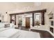 Open-concept living room featuring wood beam accents, high ceilings, and dark hardwood floors at 4822 S Gold Canyon Dr, Gold Canyon, AZ 85118