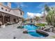 An in-ground pool with rock waterfall feature, and covered lounge with outdoor seating perfect for backyard entertaining at 4822 S Gold Canyon Dr, Gold Canyon, AZ 85118