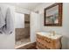 Stylish bathroom with a walk-in shower, elegant vanity, and modern fixtures at 5021 W Chicago N Cir, Chandler, AZ 85226