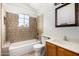 Bright bathroom features a bathtub, shower, vanity, and tiled walls at 5021 W Chicago N Cir, Chandler, AZ 85226