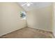 Cozy bedroom with a ceiling fan and a large window offering natural light at 5021 W Chicago N Cir, Chandler, AZ 85226