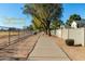 Scenic neighborhood pathway with mature trees and landscaping, perfect for walking and enjoying the outdoors at 5021 W Chicago N Cir, Chandler, AZ 85226