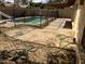 Inviting backyard features a refreshing pool, a covered patio, and a fenced-in area at 5323 W Seldon Ln, Glendale, AZ 85302