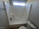 Bathroom features a shower-tub combo and a toilet at 5323 W Seldon Ln, Glendale, AZ 85302