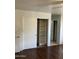 Bedroom closet with hardwood floors at 5323 W Seldon Ln, Glendale, AZ 85302