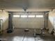 Spacious garage with overhead door, ready for vehicle storage and home projects at 5323 W Seldon Ln, Glendale, AZ 85302