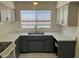 Well lit kitchen with bright counter tops, stainless steel appliances, and bright window at 5323 W Seldon Ln, Glendale, AZ 85302