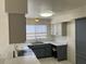 Well lit kitchen with bright marble counter tops, stainless steel appliances, and double basin sink at 5323 W Seldon Ln, Glendale, AZ 85302