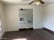 Open-concept living room with tile flooring and a view of a brick fireplace in the adjacent room at 5323 W Seldon Ln, Glendale, AZ 85302