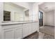 Bright bathroom features a dual sink vanity and easy access to the bedroom at 5474 W Fulton St, Phoenix, AZ 85043