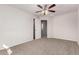 Spacious bedroom showcasing neutral walls, carpet flooring and a door to another room at 5474 W Fulton St, Phoenix, AZ 85043