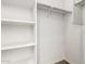 A well-organized closet with built-in shelves and a hanging rod offers ample storage at 5474 W Fulton St, Phoenix, AZ 85043