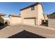 Tan two-story home with a two car garage and tile roof at 5474 W Fulton St, Phoenix, AZ 85043