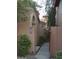 Charming walkway leading to the entrance of the home, lined with desert landscaping at 5640 E Bell Rd # 1081, Scottsdale, AZ 85254