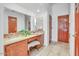 Bathroom featuring dual sinks, marble counters, vanity, and a full sized mirror at 5951 E Inglewood St, Mesa, AZ 85205