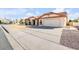 Charming single-story home featuring a well-maintained yard, tile roof, and an attached two-car garage at 5951 E Inglewood St, Mesa, AZ 85205