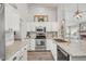 Bright kitchen with stainless steel appliances, granite counters, and pendant lighting at 5951 E Inglewood St, Mesa, AZ 85205