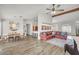 Open-concept living room with modern ceiling fan, recessed lighting, and plank flooring at 5951 E Inglewood St, Mesa, AZ 85205