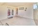 Covered patio with white walls, a concrete floor, and a partial view of the backyard at 5951 E Inglewood St, Mesa, AZ 85205