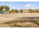 Community playground with play structures, basketball court, and open fields, ideal for Gathering fun and recreation at 5951 E Inglewood St, Mesa, AZ 85205