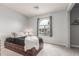 Bedroom with a unique arch window letting in bright natural light at 627 W Flower Ave, Mesa, AZ 85210