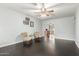 Bright living room showcasing dark wood floors, ceiling fan, and an open floor plan at 627 W Flower Ave, Mesa, AZ 85210