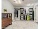 Spacious walk-in closet features custom shelving, hanging racks, and a large dressing area at 627 W Flower Ave, Mesa, AZ 85210