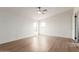 Bright bedroom featuring light wood floors, white walls and windows offering lots of natural light at 6901 W Patricia Ann Ln, Peoria, AZ 85382