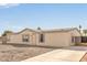 Desert home featuring desert landscaping with a bright facade under a clear, blue sky at 6901 W Patricia Ann Ln, Peoria, AZ 85382