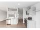 Well-lit kitchen featuring stainless steel appliances, white cabinets, and light-colored wood flooring at 6901 W Patricia Ann Ln, Peoria, AZ 85382