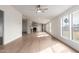 Bright living room featuring wood-look floors and large windows offering lots of natural light at 6901 W Patricia Ann Ln, Peoria, AZ 85382