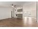 Spacious living room with light wood floors that transitions into the kitchen, open and modern space at 6901 W Patricia Ann Ln, Peoria, AZ 85382