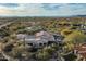 Attractive aerial perspective of a desert residence featuring a tile roof and arid vegetation with mountain scenery at 7363 E Lower Wash Pass, Scottsdale, AZ 85266