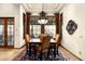 Elegant dining room with stylish chandelier and view to outdoor living area at 7363 E Lower Wash Pass, Scottsdale, AZ 85266