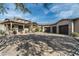 Elegant home featuring a circular driveway and a three-car garage, perfect for car enthusiasts at 7363 E Lower Wash Pass, Scottsdale, AZ 85266