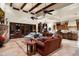 Inviting living room featuring an open layout, fireplace, and seamless access to the kitchen and patio at 7363 E Lower Wash Pass, Scottsdale, AZ 85266