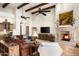 Beautiful living room with a stone fireplace, beamed ceilings, and stylish decor at 7363 E Lower Wash Pass, Scottsdale, AZ 85266