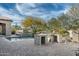 Stylish outdoor kitchen and pool area, ideal for entertaining and enjoying outdoor cooking in a luxurious setting at 7363 E Lower Wash Pass, Scottsdale, AZ 85266