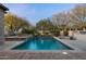 Private pool and spa surrounded by lush desert landscaping offer a tranquil escape at 7363 E Lower Wash Pass, Scottsdale, AZ 85266