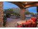 Outdoor living space with a covered patio, pool, spa, and outdoor kitchen at 7363 E Lower Wash Pass, Scottsdale, AZ 85266