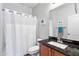 Well-maintained bathroom with a shower-tub combo and a granite-topped vanity at 7387 W Remuda Dr, Peoria, AZ 85383