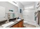 Bright bathroom showcasing double sinks, decorative whale art, and a shower-tub combo at 7387 W Remuda Dr, Peoria, AZ 85383