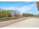 A large patio with railing looks out onto the street and neighborhood at 7387 W Remuda Dr, Peoria, AZ 85383