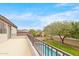 An extended patio with a railing provides views to a backyard and pool at 7387 W Remuda Dr, Peoria, AZ 85383