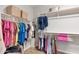 Bright walk-in closet with shelving and hanging rods offering abundant storage space for clothes and personal items at 7387 W Remuda Dr, Peoria, AZ 85383