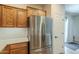 Modern kitchen featuring stainless steel appliances, subway tile backsplash, and wooden cabinets at 7525 W Springfield Way, Florence, AZ 85132