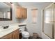 Bathroom featuring a vanity, toilet, and a shower with glass doors at 7750 E Broadway Rd # 54, Mesa, AZ 85208