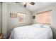 Bedroom with neutral walls and two windows for natural light at 7750 E Broadway Rd # 54, Mesa, AZ 85208