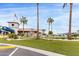 Well-manicured clubhouse grounds with palm trees and lush green spaces, perfect for community gatherings and events at 7750 E Broadway Rd # 54, Mesa, AZ 85208